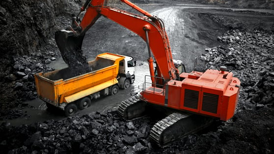 An excavator working in a mine quarry