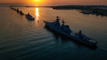 Military fleet at sunset