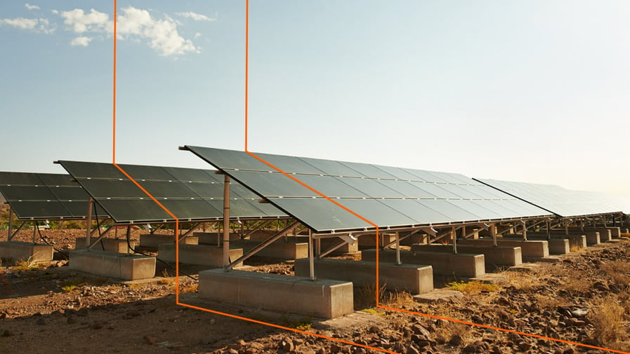 Shot of a row of solar panels basking in the sun to generate electricity for the nearby holiday resort in Namibia