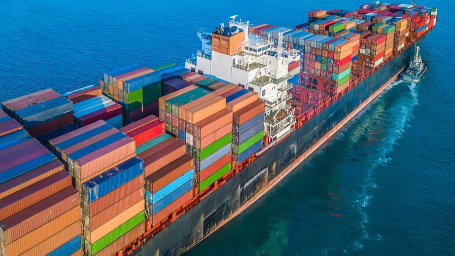 Large cargo ship at sea with shipping containers
